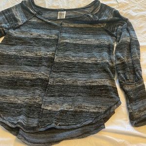 Free People oversized tunic light sweater with sleeve detail.